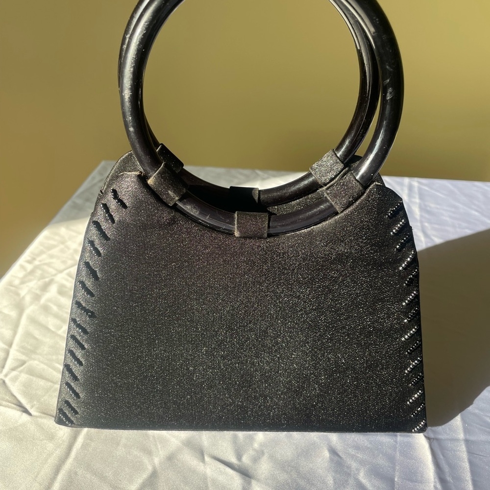 Elegant Black Handbag with Circular Handles